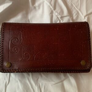 Vintage leather handmade clutch/pouch. Snap closure.